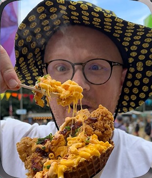 Tod eating festival food, shown on a mint smartwatch worn by a 3D toy hand